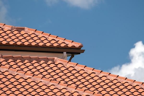 red roof tiles in a modern design under a blue sky showcasing six beautiful angles of architecture