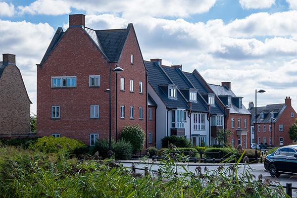modern residential buildings with varied architecture surrounded by greenery and 3 residential areas