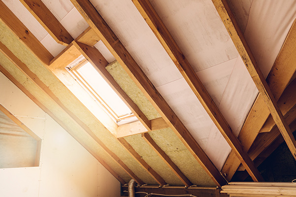 interior view of a roof with wooden beams and a skylight providing natural light perfect for modern renovation projects 3 ways to enhance interior light