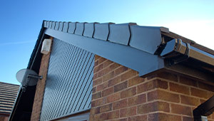 A dry ridge system on a pitched roof