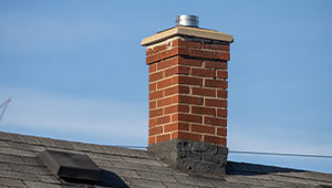 A chimney sat against a blue sky
