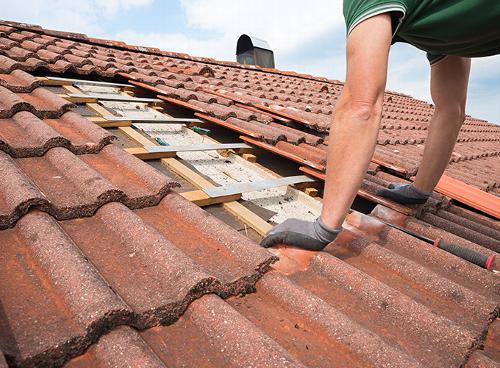 A man repairing a roof